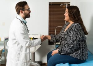 Doctor consulting patient for obesity and BMI evaluation